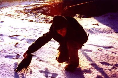 Josh feeding Fernando, a crow